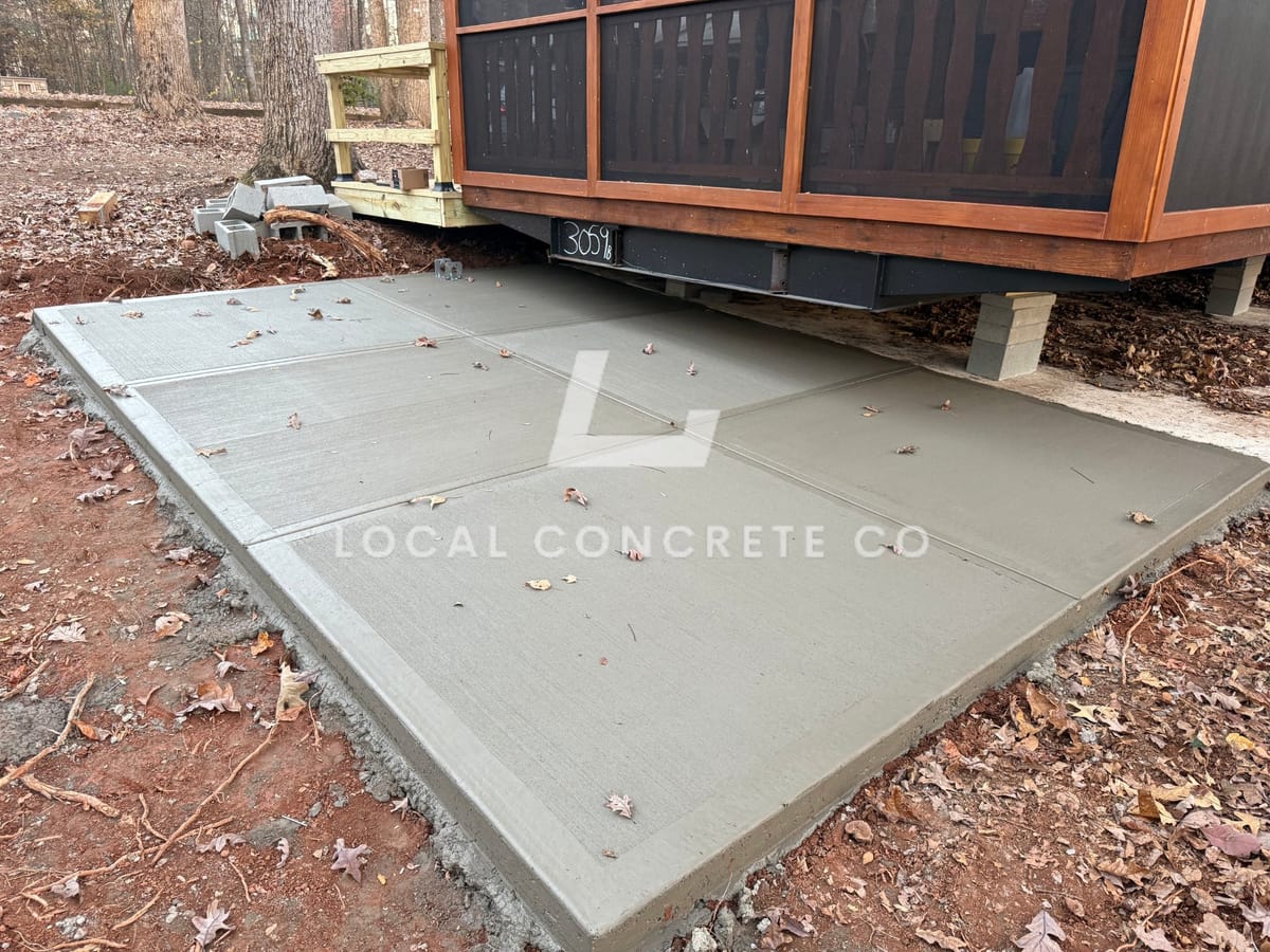Newly poured Concrete Patios in Charlotte, NC (Mecklenburg County) by Local Concrete Co — 4000 PSI mix, double-mat #4 rebar, broom-finish surface, 28-day full cure.